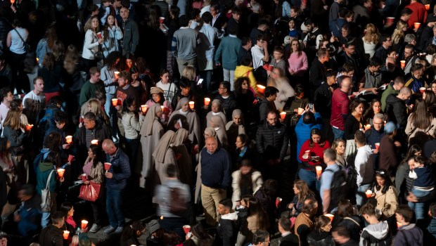 A general view shows people gathering at the Colosseum before the Way of the Cross (Via Crucis