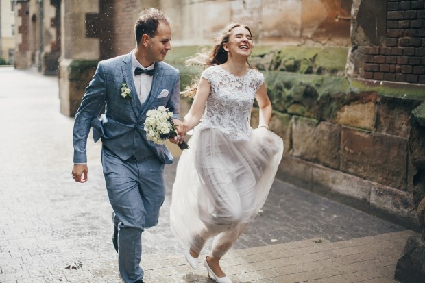 Couple running rain