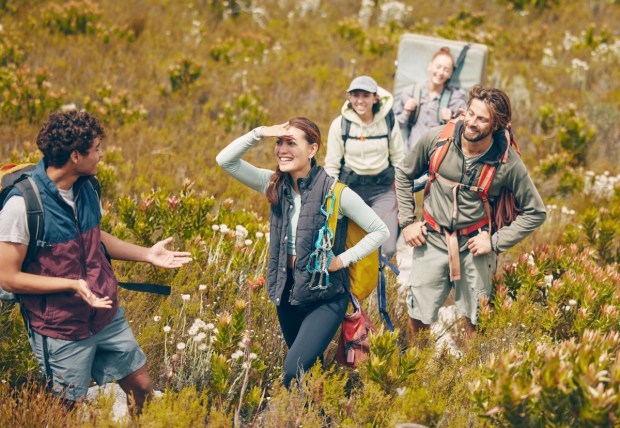 Group hiking, nature travel and guide in communication with friends