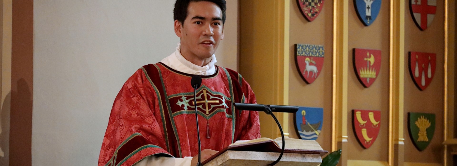 Deacon Mathias Bruno Ledum addresses congregation at his ordination in Oslo, Norway