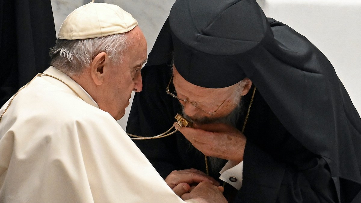 Ecumenical Patriarch Bartholomew I reverences pectoral cross of Pope Francis