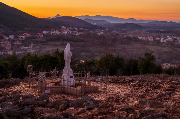 Pilgrims-in-Medjugorje-Statue-of-Virgin-Mary