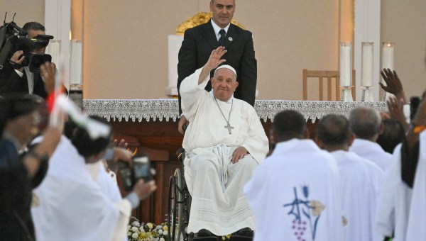 Pope Francis waves to the crowd during a mass at the Esplanade of Tasitolu in Dili, East Timor, on September 10, 2024.