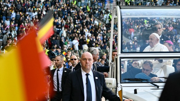 Pope Francis looks on from the popemobile as he arrives at King Badouin Stadium to hold a holy mass, in Brussels on September 29, 2024. The pope is on a four-day apostolic journey to Luxembourg and Belgium.