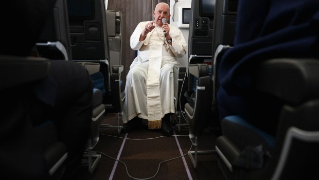 Pope Francis holds a news conference aboard the papal plane on his flight back after his 12-day journey across Southeast Asia and Oceania, on September 13, 2024.