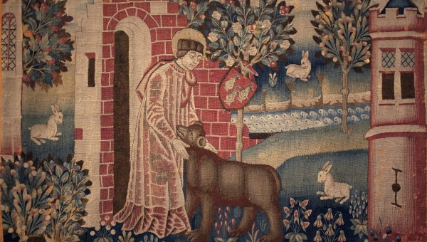 Saint Waast, ou Gaston, apprivoise un ours brun.