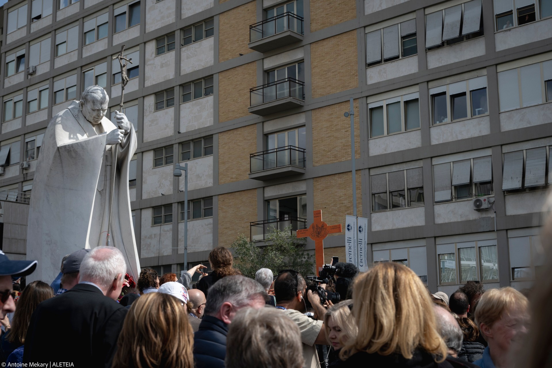 Pope Francis waves from a window of the Gemelli hospital before to be discharge after a five weeks hospitalization for pneumonia, in Rome on March 23, 2025