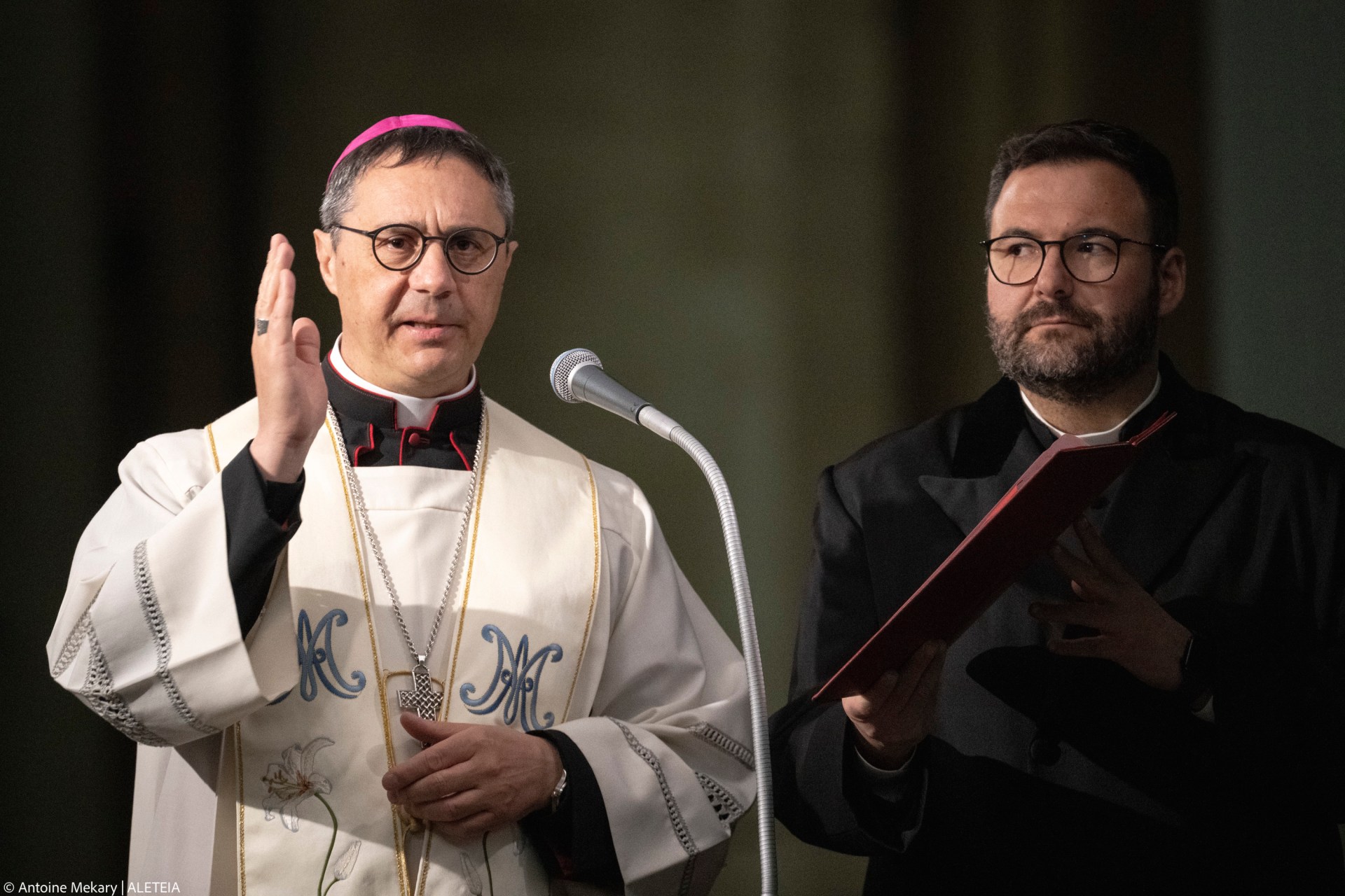 Mons. Emilio Nappa prays during a rosary prayer for Pope Francis' health in St. Peter's Square at the Vatican, March 15, 2025.