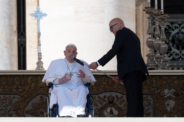Pope Francis is pushed in a wheelchair on St. Peter's square to conduct the Angelus prayer in The Vatican, on April 6, 2025.