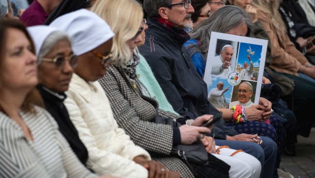 Devotees attend a Rosary in homage to Pope Francis following his death in Saint Peter's Square, the Vatican, on April 21, 2025
