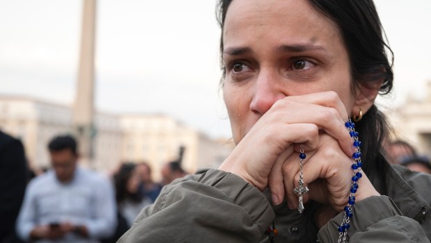 Devotees attend a Rosary in homage to Pope Francis following his death in Saint Peter's Square, the Vatican, on April 21, 2025