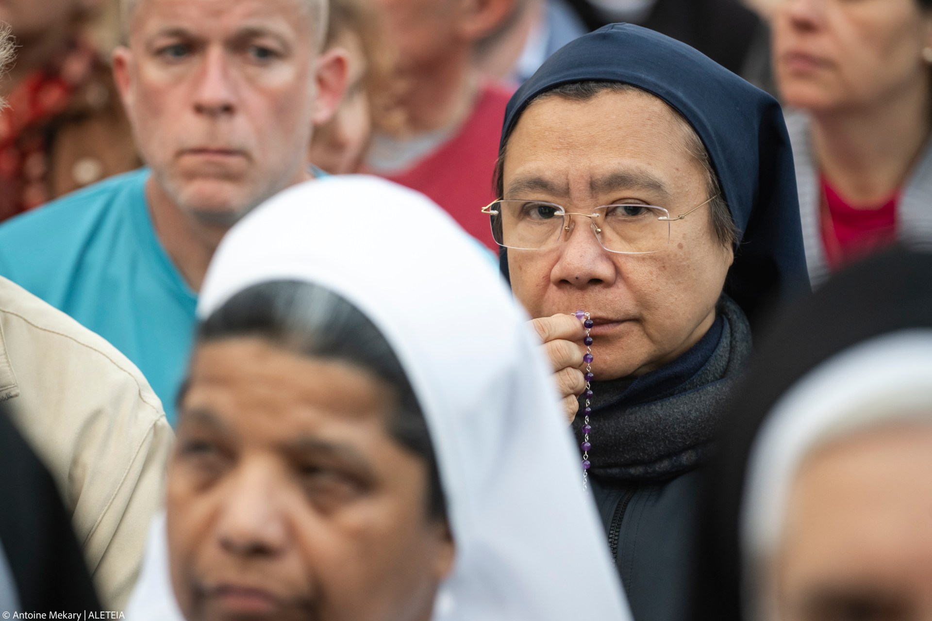 Devotees attend a Rosary in homage to Pope Francis following his death in Saint Peter's Square, the Vatican, on April 21, 2025