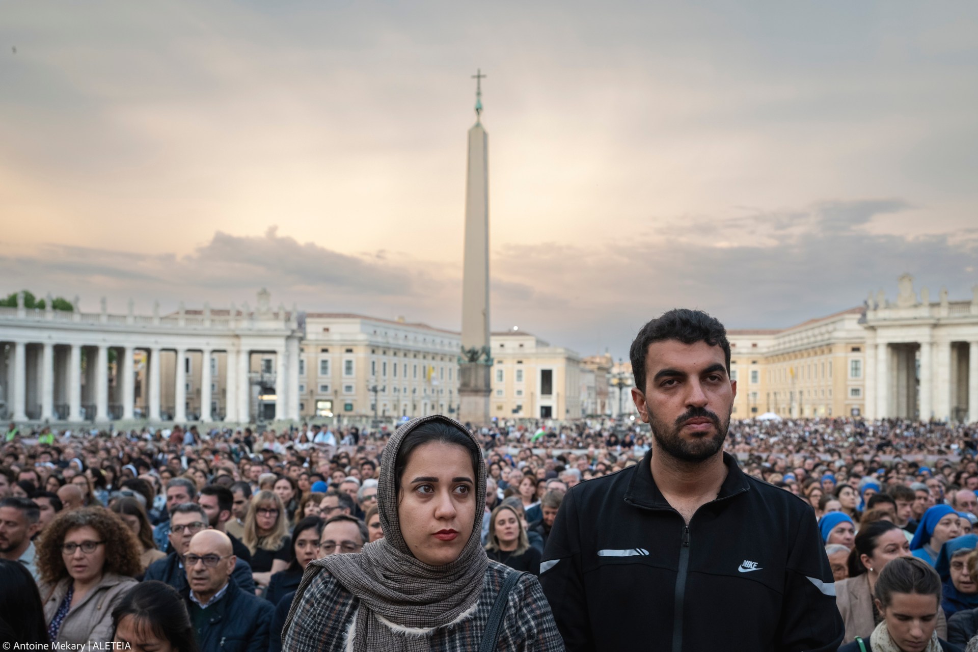 Devotees attend a Rosary in homage to Pope Francis following his death in Saint Peter's Square, the Vatican, on April 21, 2025