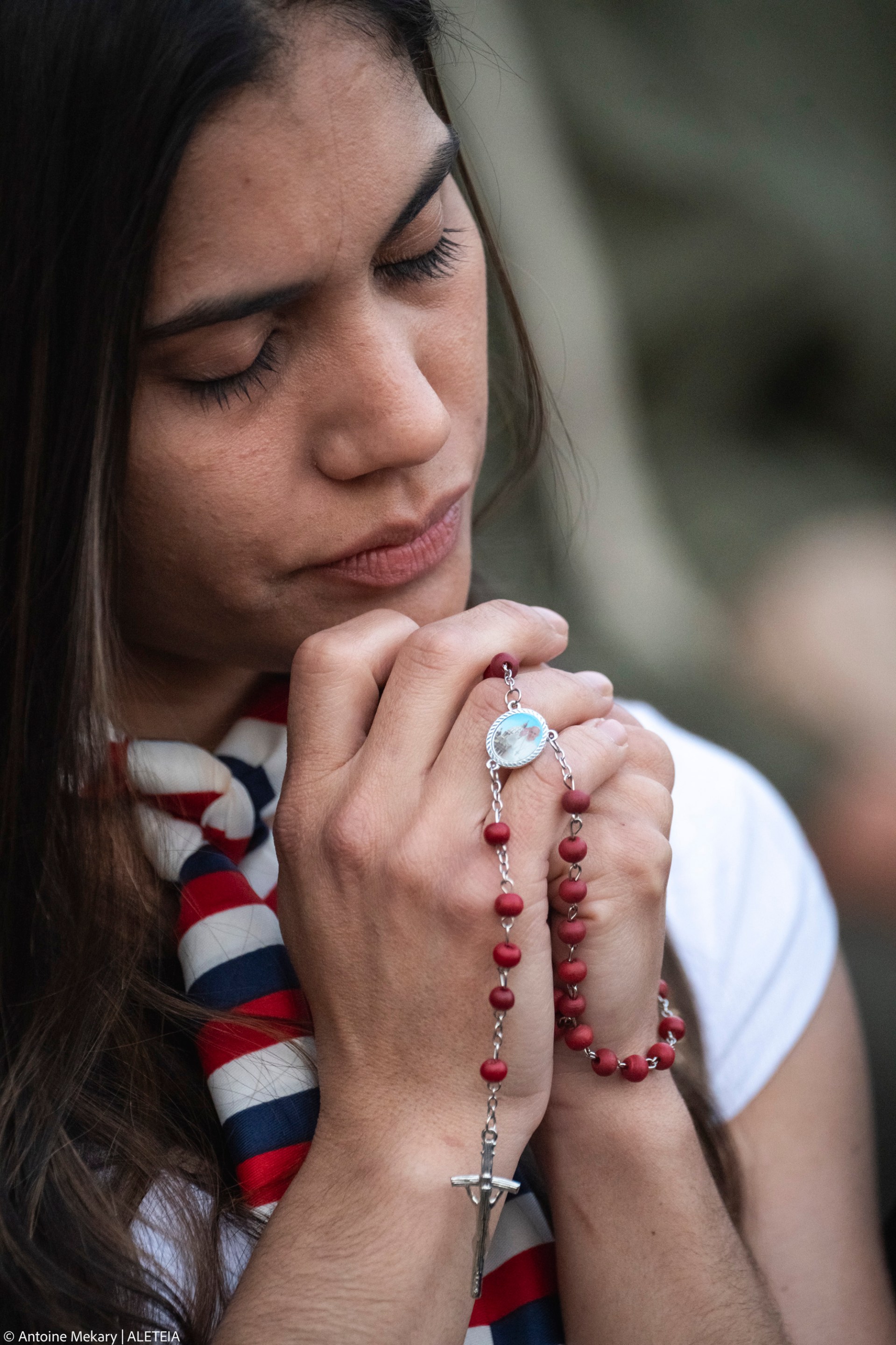 Devotees attend a Rosary in homage to Pope Francis following his death in Saint Peter's Square, the Vatican, on April 21, 2025