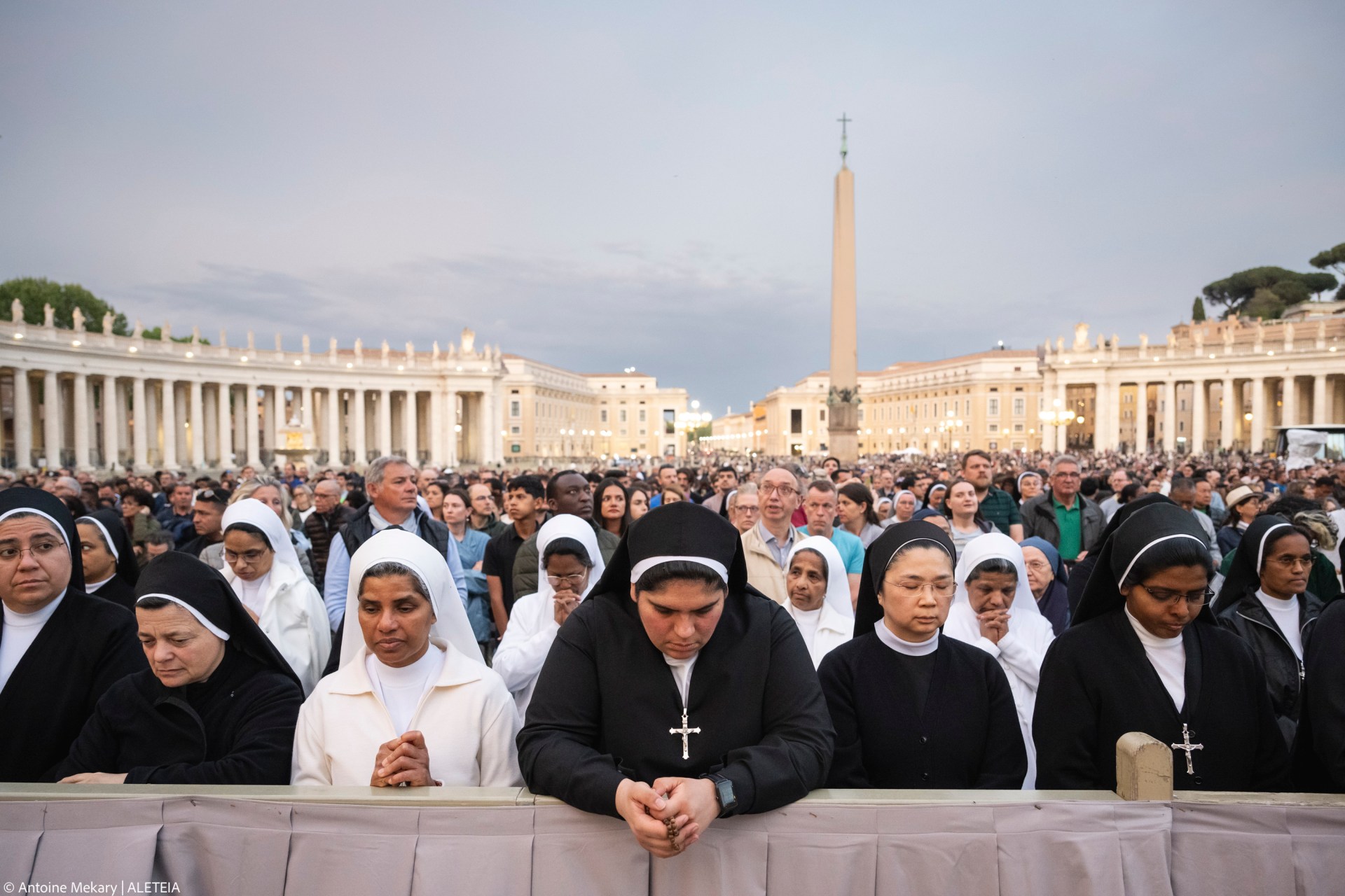 Devotees attend a Rosary in homage to Pope Francis following his death in Saint Peter's Square, the Vatican, on April 21, 2025