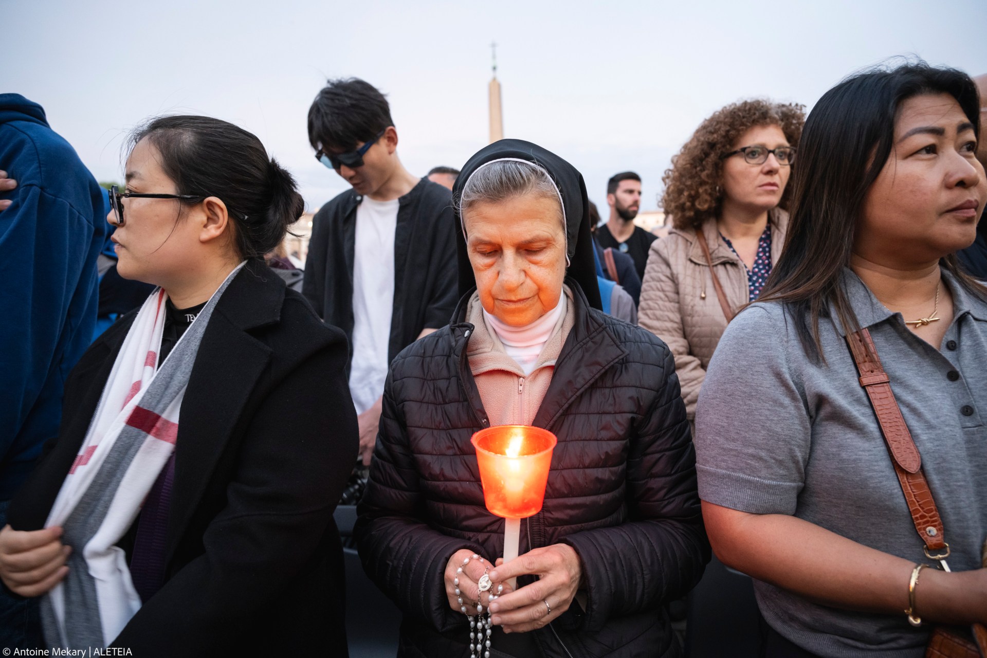 Devotees attend a Rosary in homage to Pope Francis following his death in Saint Peter's Square, the Vatican, on April 21, 2025