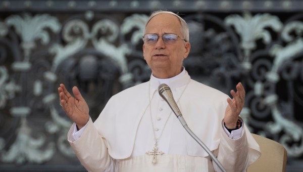 Pope Leo XIV prays at the end of his first weekly general audience at St Peter's Square in The Vatican on May 21, 2025.