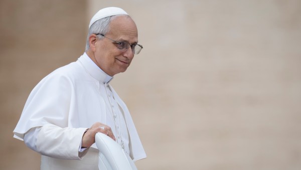 Pope Leo XIV waves to the crowd at the end of his first weekly general audience at St Peter's Square in The Vatican on May 21, 2025.