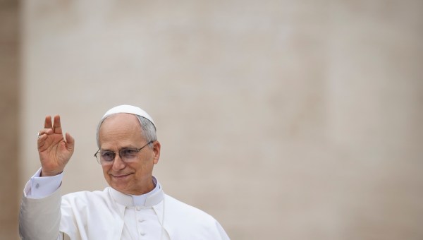 Pope Leo XIV waves to the crowd at the end of his first weekly general audience at St Peter's Square in The Vatican on May 21, 2025.