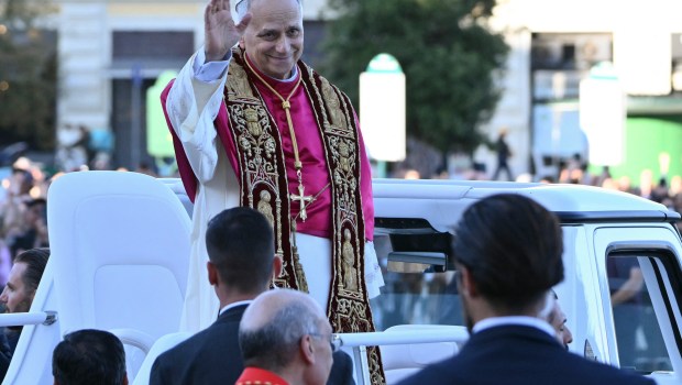 Pope Leo XIV waves to the crowd from the popemobile as he leaves Saint John Lateran archbasilica after a holy mass in Rome, on May 25, 2025.