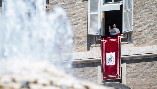 Pope Leo XIV blesses the crowd from a window of the apostolic palace overlooking St Peter's Square during the Angelus prayer in The Vatican on June 21, 2026.